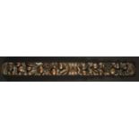 A Carved Flemish Frieze/Drawer Front having a central keyhole flanked by garlands of fruit and