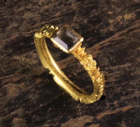 An 18th Century 22 Carat Gold Memorial Ring with square cut quartz flanked by panels inscribed 'J