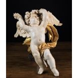 A Painted Wood Carving of a Baroque Cherub.