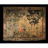 A 17th Century Flemish Tapestry (A/F) depicting a woodland scene with a lady and attendant