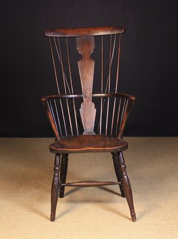 A 19th Century Comb-back Windsor Armchair.