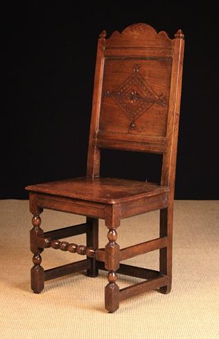 A Late 17th/Early 18th Century Cheshire/Lancashire Oak Panel Back Chair with lozenge carved back