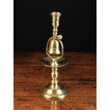 An 18th Century Heemskerk Tavern Bell Candlestick incorporating a bell above the drip pan,