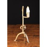 An 18th Century Wrought Iron Tripod Table Rushnip having a rolled candle socket on horizontal arm