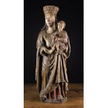 A Fabulous 16th Century Carved Wood Sculpture of Virgin & Child with traces of residual polychromy.