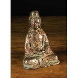 A 17th Century Hollow Cast Bronze Buddha with traces of residual lacquer & gilding,