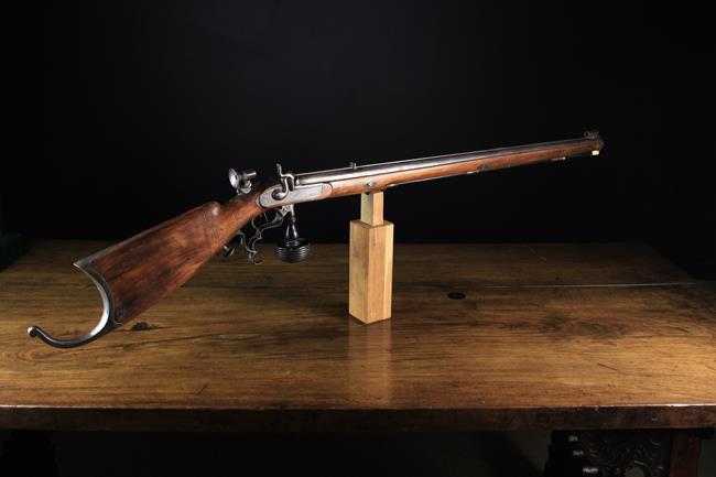 A Rare 19th Century Percussion Sporting Rifle with integral turned ebony stock rest and adjustable
