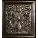 A 17th Century 'Flowerpotte' Oak Panel recessed in a moulded frame and depicting a baluster vase