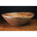 A Large, Shallow Dug Out & Turned Oak Bowl with slightly raised foot, 3 in (8 cm) high,