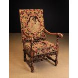 A 17th Century Style Upholstered Walnut Open Armchair.