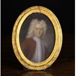 An Early 18th Century Oil on Copper Head & Shoulders Portrait of a wigged gentleman with red frock