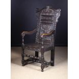 A Victorian Carved Oak Wainscot Chair.