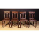 A Set of Four 19th Century Neo-Gothic Oak Side Chairs.