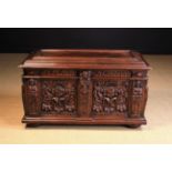 A Continental Carved Oak Coffer in the Early 17th Century Style.