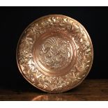A 19th Century Embossed Copper Charger.