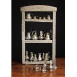 A Small Unit of Wooden Wall Shelves holding a collection of antique pewter, mainly 19th century.