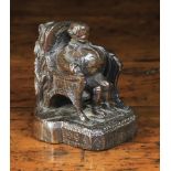 A Small 19th Century Treen Carving of a portly gentleman sat on human-footed chair with a clump of