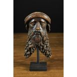 A 16th Century Wood Carving of a Man's Head finely detailed with a long forked curly beard,