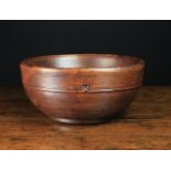 A Turned Treen Bowl 5½ in (14 cm) high, 11½ in (29 cm) in diameter.