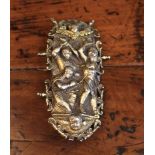 A 16th/17th Century Oval Book Clasp intricately cast as Saint Sebastian & Tiburtius between winged