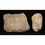 Two Naively Carved Stone Heads.