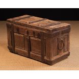 A Small 16th/17th Continental Chest with moulded twin panel lid and sides bound in iron straps and