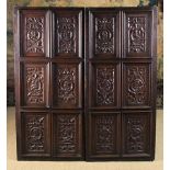 A Set of Twelve French Renaissance Carved Oak Panels set into a pair of 19th century doors.