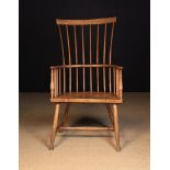 A 20th Century Ash & Alder Comb-back Windsor Armchair.