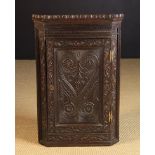 A Late 18th Century Oak Hanging Corner Cupboard.