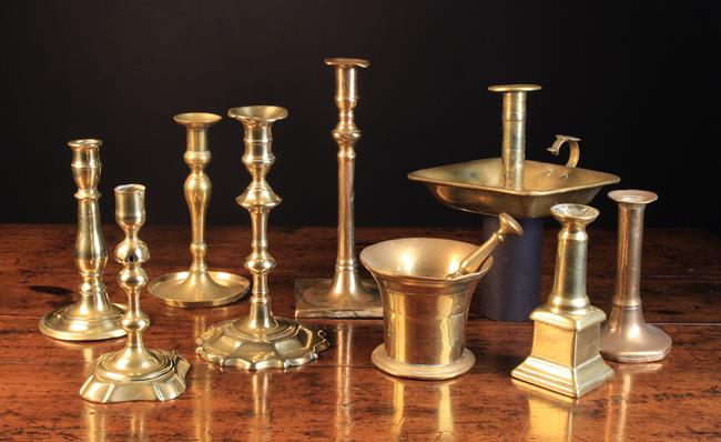 A Collection of 18th Century Brass Ware; A Pestle & Mortar and eight various Candlesticks.