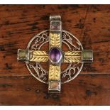 A Silver Pendant Celtic Cross enriched with gold overlay embossed with leaves and centred by an