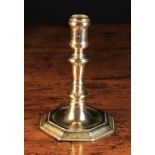 A Late 17th Century French or Dutch Candlestick with an elongated inverted acorn knop and octagonal