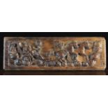 A 17th Century Ornamental Oak Drawer Front carved in relief with Helios on his horse-drawn chariot