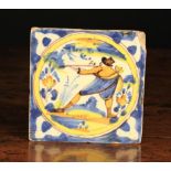 A 17th Century Delft Polychrome Tile decorated in manganese, ochre,