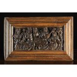 A Fine 16th Century Oak Scenic Panel carved in relief with a social gathering depicting a lady with