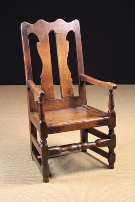 An 18th Century Joined Oak Armchair.