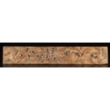 A 16th/17th Century Carved Renaissance Frieze Rail displaying undulant scrolls of zoomorphic