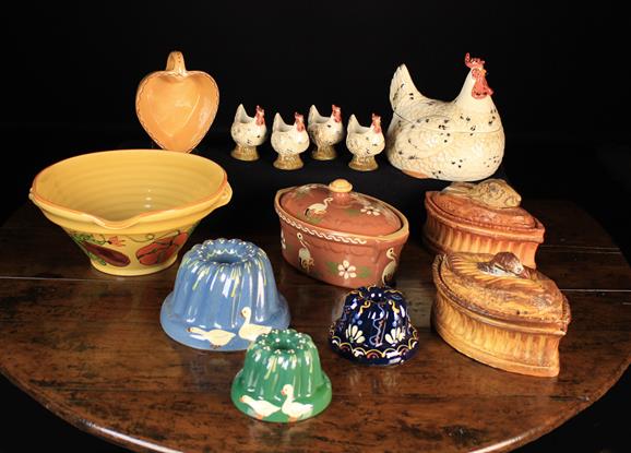 A Group of Kitchen Pottery: A pair of French early 20th century relief-moulded Majolica game dishes