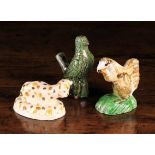 Three Pottery Animals; A 19th century green glazed red clay bird whistle, 4 in (10 cm) in height,