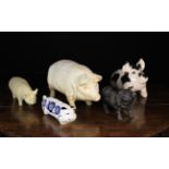 Five Ornamental Pigs: Two cast from metal and painted; one white 17 in (43 cm) in length,