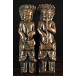 A Pair of 17th Century Flemish Carved Oak Figural Terms carved as cherubic musicians crowned with