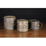 Three Early 19th Century Iron Bound Coopered Oak Costrels of cylindrical form,
