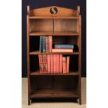 A Small Group of Books housed in an Oak Bookcase.