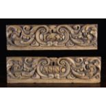 A Pair of 17th Century Drawer Fronts carved with undulating scrolls of foliage and dated in central