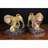 A Pair of Early 19th Century Staffordshire Pearlware Pottery Lions.