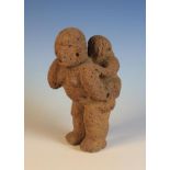 An Ethnic Stone Carving of a Mother & Child 9¾ in (25 cm) in height.