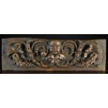 An 18th Century Oak Frieze rail boldly carved with exuberant scrolls of seeding husk flowers and