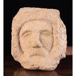 A Medieval Carved Stone Head of bearded man, 9" x 8" (23 cm s x 20 cm).