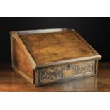 An 18th Century Oak Bible Box. The carved front board dated 1705 and initialled JC.