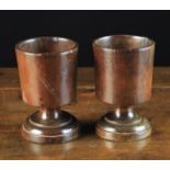 A Pair of 19th Century Turned Beechwood Goblets with cylindrical bowls on short stems and round